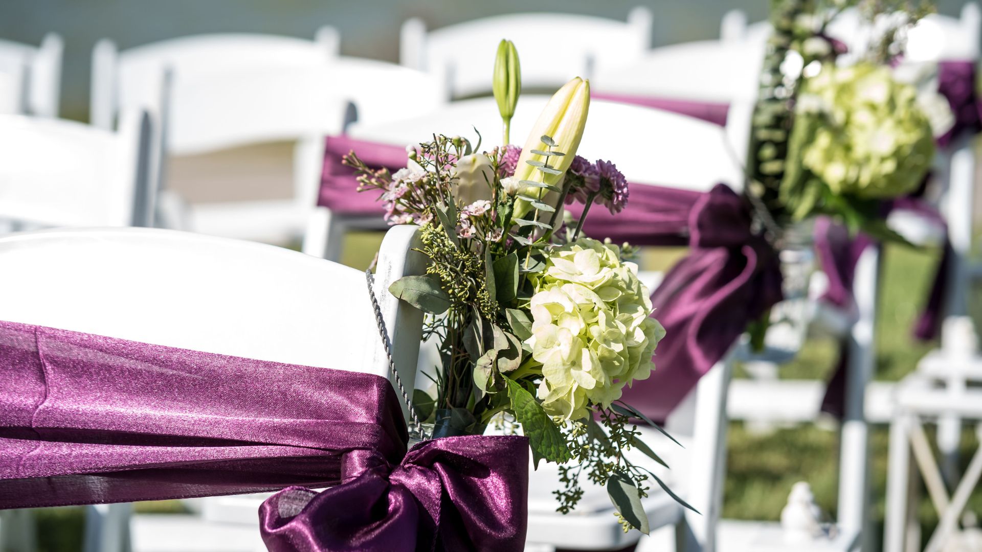 eggplant purple and white lily beach wedding decor