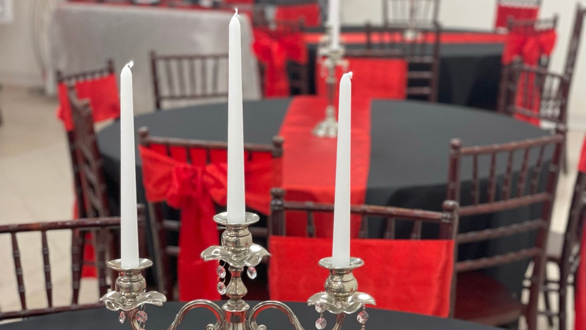 black and red wedding reception with candelabras with chiavari chairs