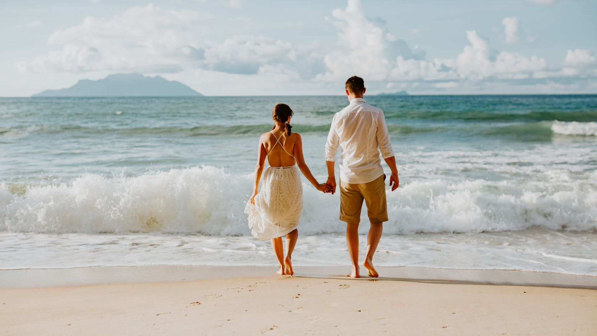 beach wedding bride and groom barefoot ceremony