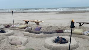 beach wedding reception with bonfire