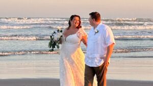 sunset wedding portrait of bride and groom on beach